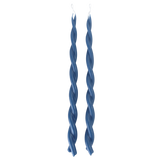A pair of twisted pure beeswax taper candles infused with plant-based pigments in M Denim blue-hue