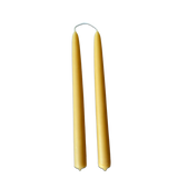 Hand-dipped beeswax taper candles in natural yellow hue no drip, crafted for a luxurious look.