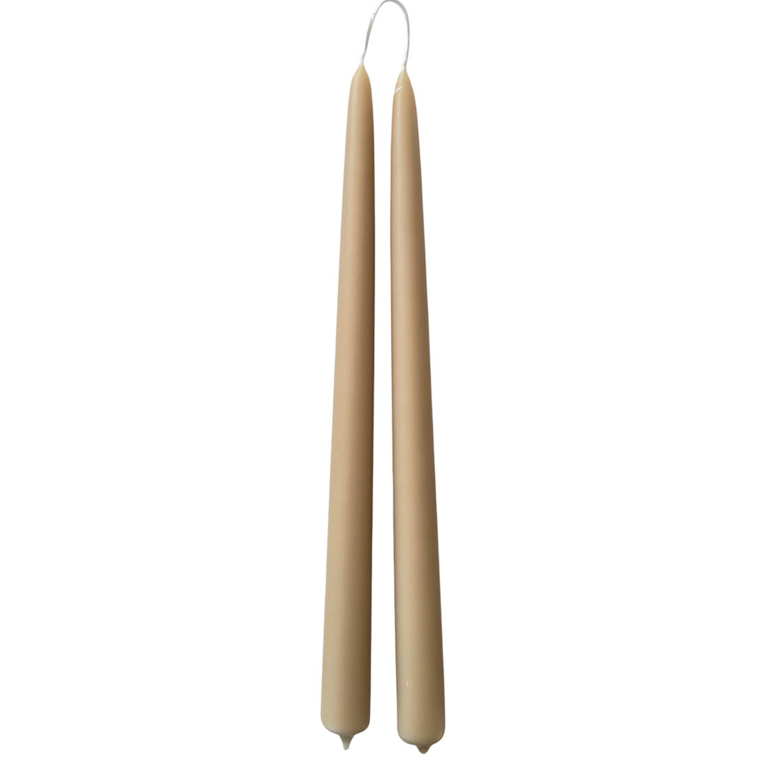 A pair of pure beeswax dripless taper candles, hand dipped in Tan