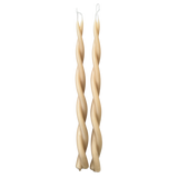 A pair of GLŌAM hand-twisted beeswax candles in Tan-beige hue, crafted with plant-based pigments.