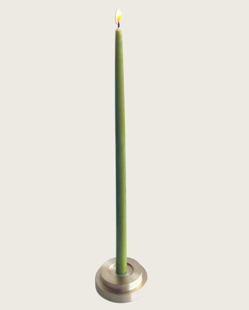 GLŌAM thin taper golden brass holder, a sculptural minimalist brass base made for Thin beeswax tapers, solid polished brass