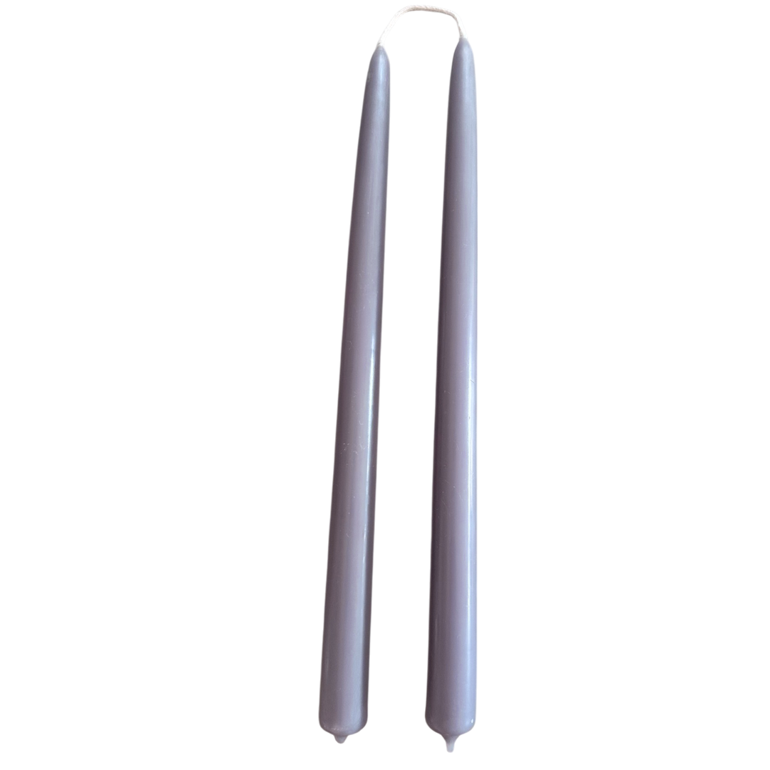 GLŌAM 12" hand-dipped beeswax taper candles in Lavender — a soft purple, made in Santa Barbara with natural plant-based pigments.