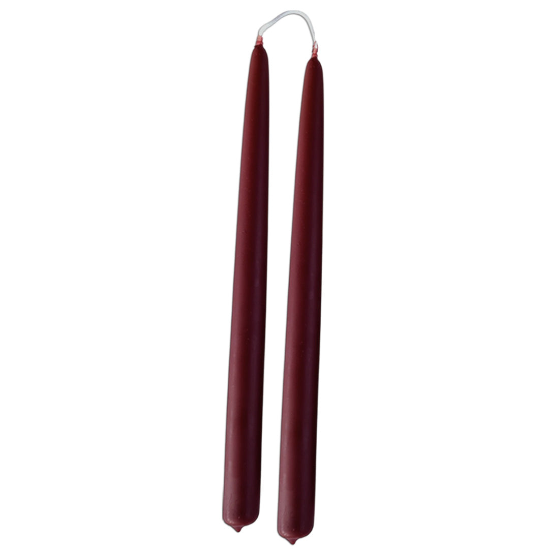 GLŌAM 12" hand-dipped beeswax taper candles in Mulberry — a deep red-purple, made in Santa Barbara with natural plant-based pigments.