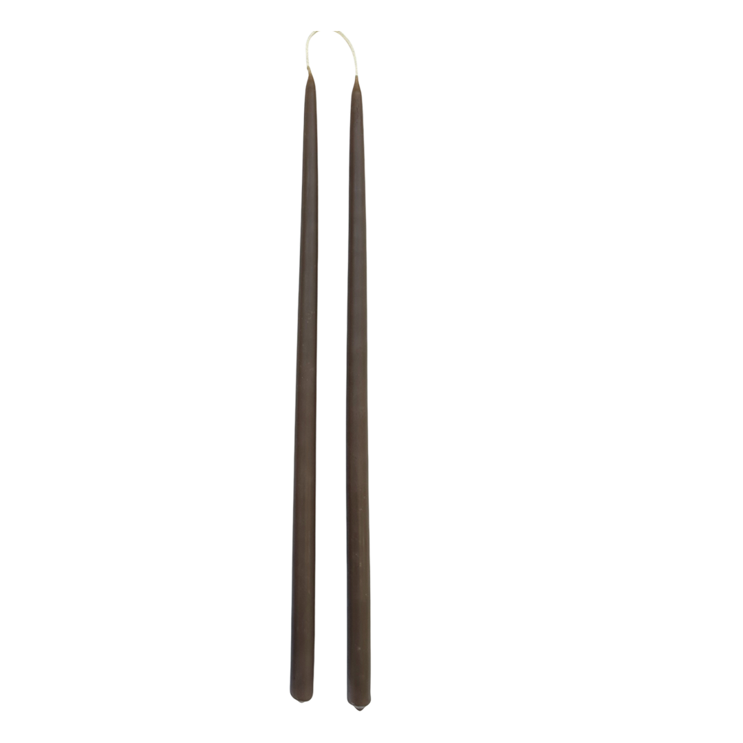 GLŌAM 12" hand-dipped thin beeswax taper candles in Carob — a warm earthy brown, made in Santa Barbara with natural plant-based pigments.