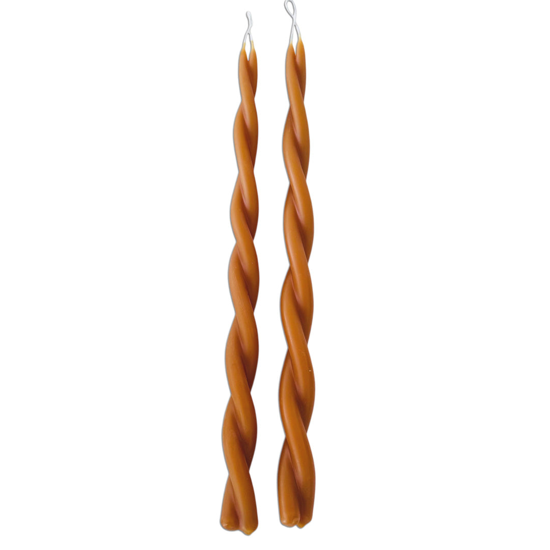 GLŌAM 12" hand-dipped twisted beeswax taper candles in Ochre — a rich mustard yellow, made in Santa Barbara with natural plant-based pigments.