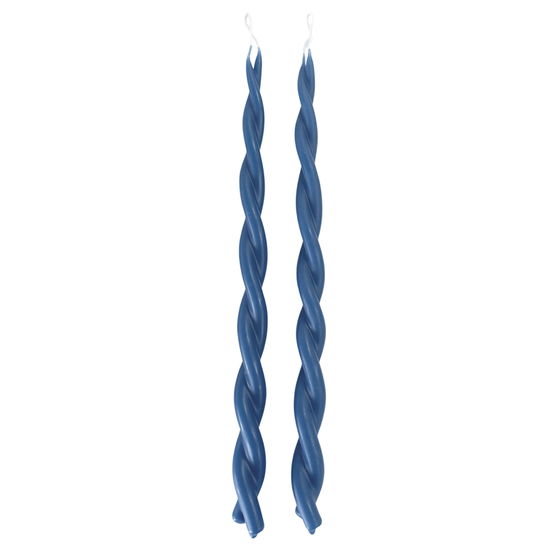A pair of twisted pure beeswax taper candles infused with plant-based pigments in M Denim blue-hue