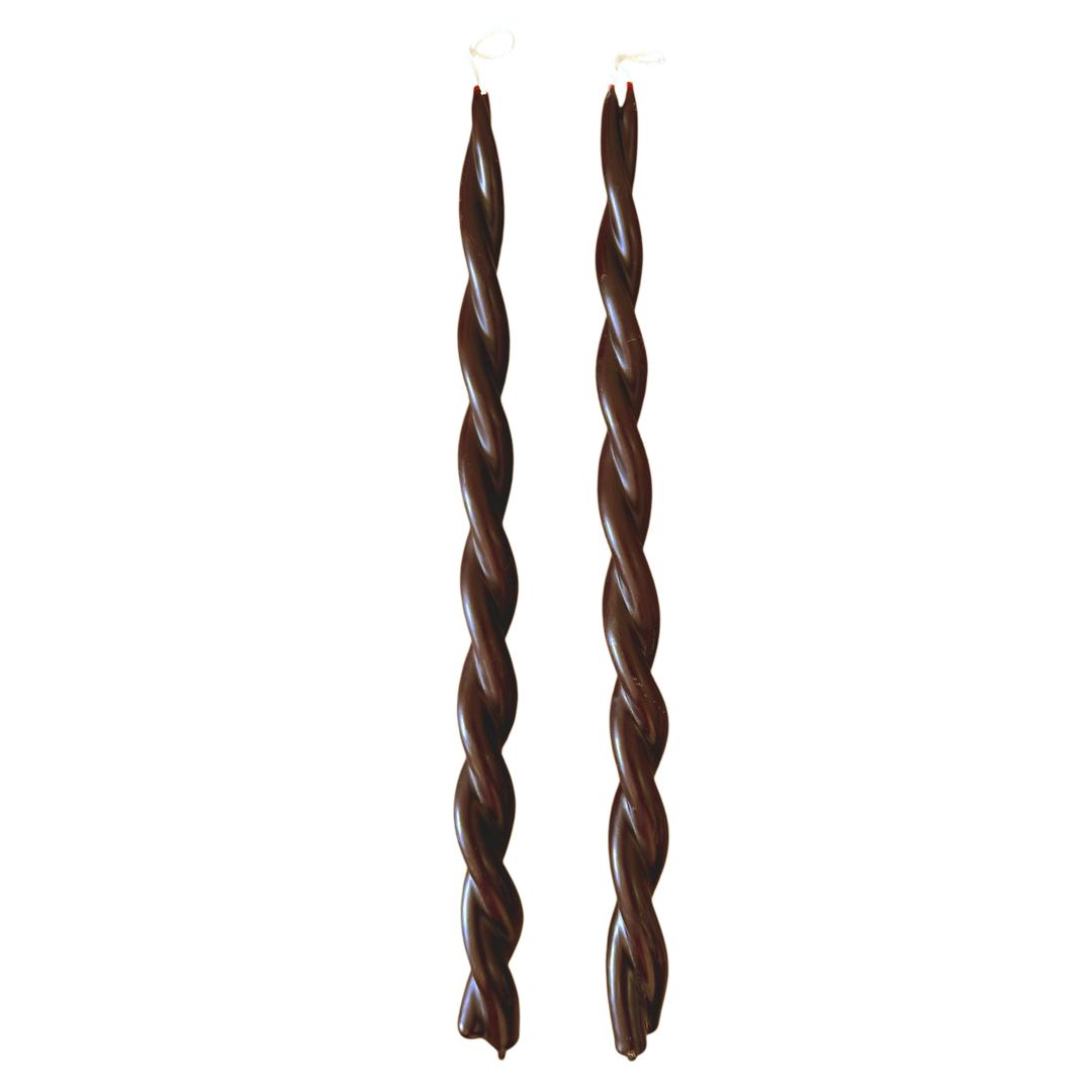 A pair of GLŌAM hand-twisted beeswax candles in Creme De cassis, a chocolate- brown hue, crafted with plant-based pigments