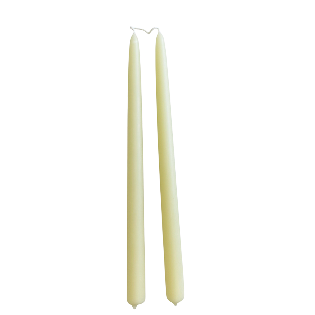 A pair of creamy-light-yellow color, in Beurre, hand-dipped beeswax taper candles made with natural plant-based pigments for an eco-friendly, non -drip, elegant home decor accent.