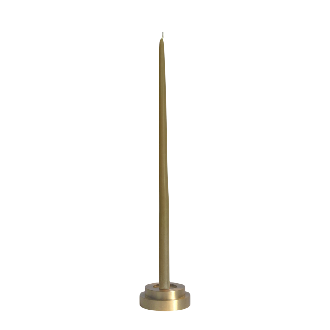 A high quality solid brass modern holder for skinny taper candle