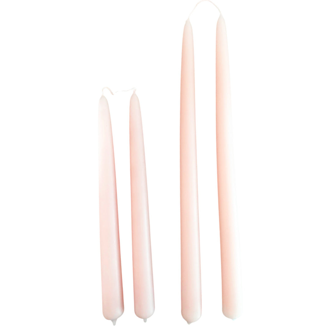 Hand-dipped beeswax taper candles in Cashmere- powdery-peach hue, crafted with plant-based pigments for a luxurious look.