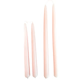 Hand-dipped beeswax taper candles in Cashmere- powdery-peach hue, crafted with plant-based pigments for a luxurious look.