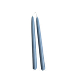 Hand-dipped beeswax taper candles in blue, crafted with plant-based pigments for a luxurious look.