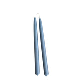 Hand-dipped beeswax taper candles in blue, crafted with plant-based pigments for a luxurious look.