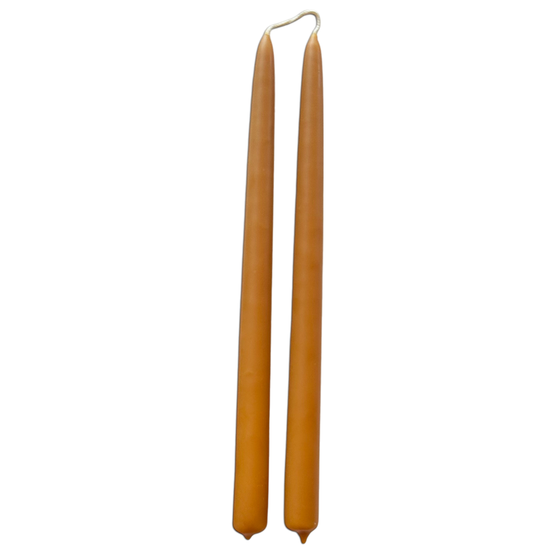 GLŌAM 12" hand-dipped beeswax taper candles in Ochre — a warm golden yellow, made in Santa Barbara with natural plant-based pigments