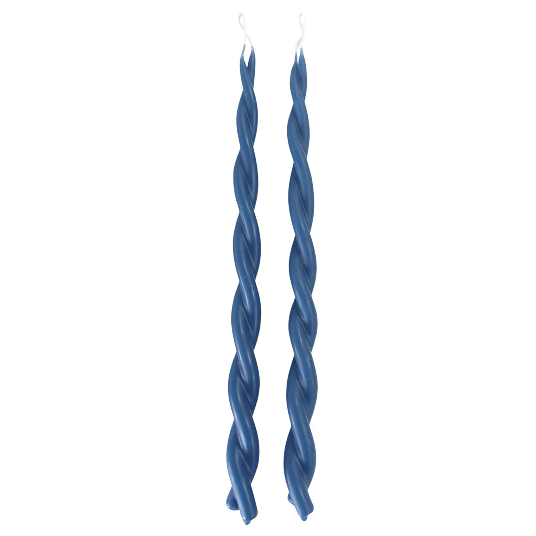 A pair of twisted pure beeswax taper candles infused with plant-based pigments in M Denim blue color