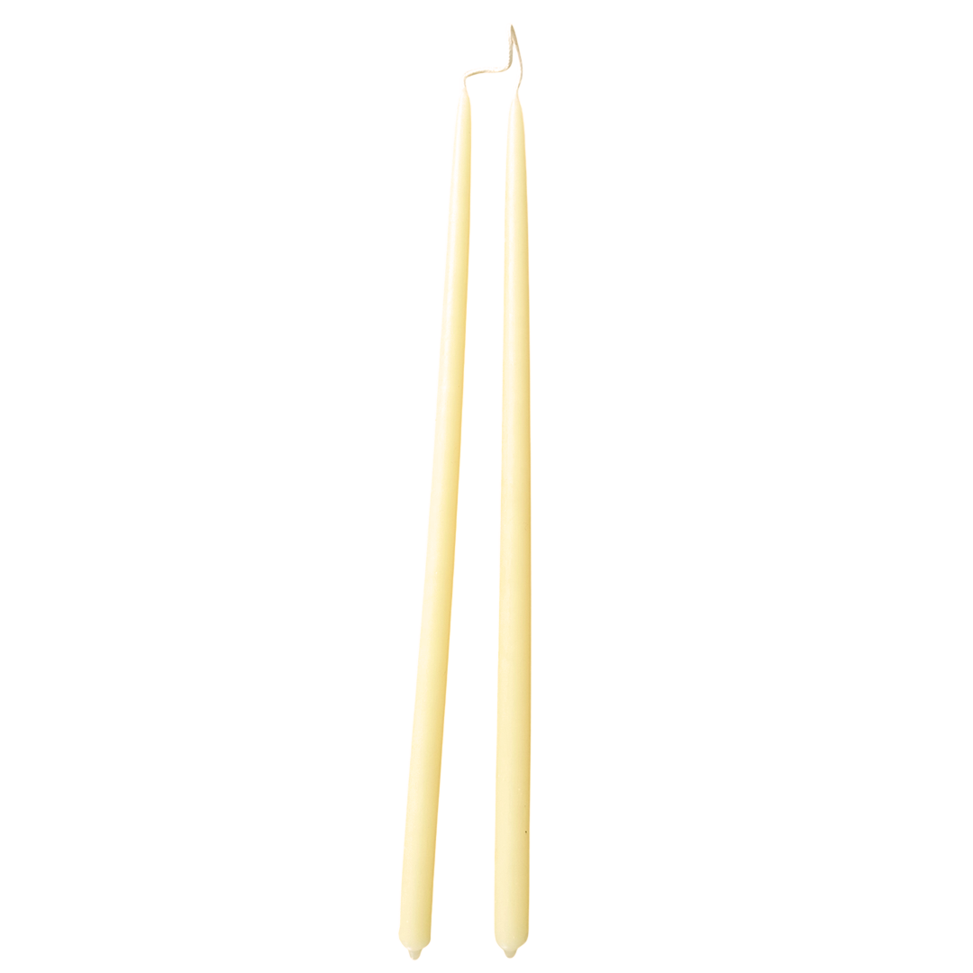 a pair of sustainable, beeswax thin taper candles, hand-dipped  in Beurre, light yellow hue, Danish-inspired design