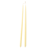a pair of sustainable, beeswax thin taper candles, hand-dipped  in Beurre, light yellow hue, Danish-inspired design