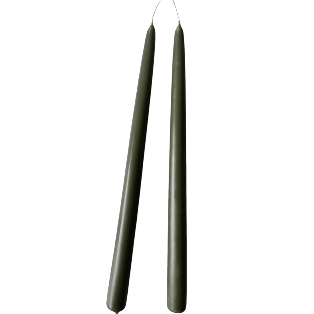 a pair of pure beeswax taper candles hand dipped in Dark Pine