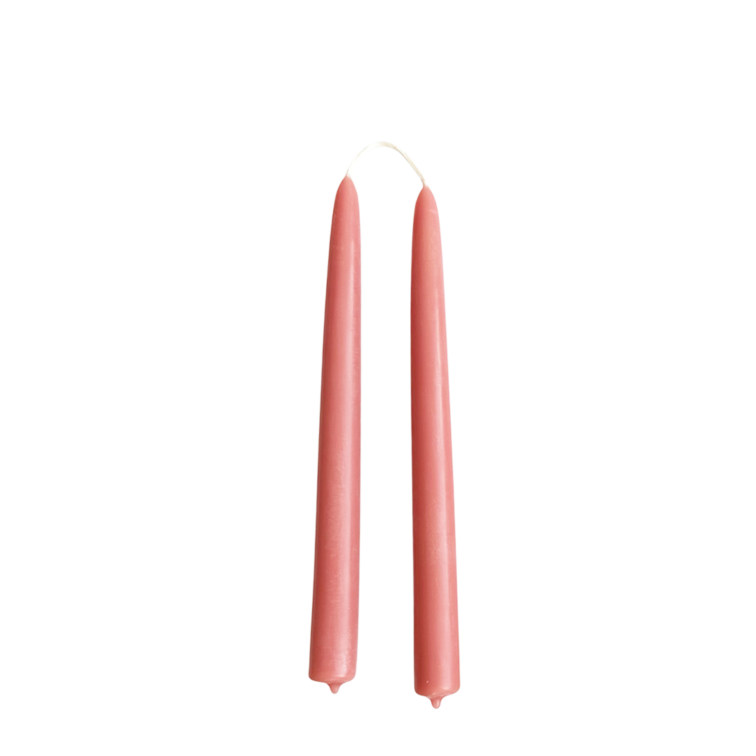 Hand-dipped beeswax taper candles in an orange-pink warm hue no drip, crafted for a luxurious look.