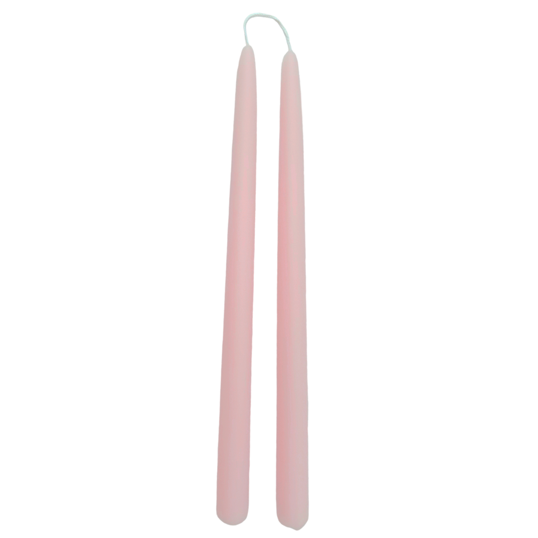 A pair of dusty pink color, hand-dipped beeswax taper candles made with natural plant-based pigments for an eco-friendly, non -drip, elegant home decor accent.