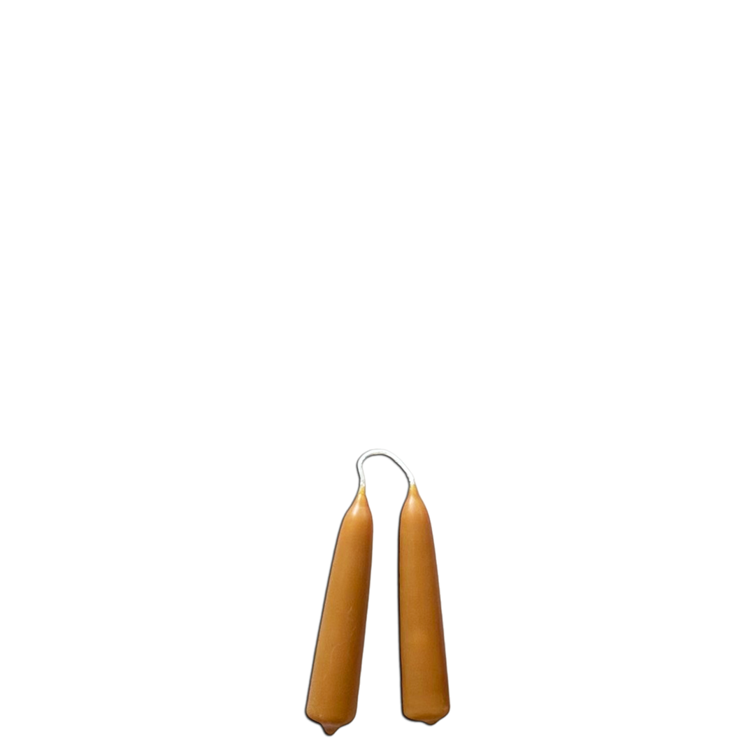 A pair of beeswax mini taper candles in martini,, long burn