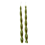 A pair of GLŌAM hand-twisted beeswax candles in Martini, crafted with plant-based pigments.