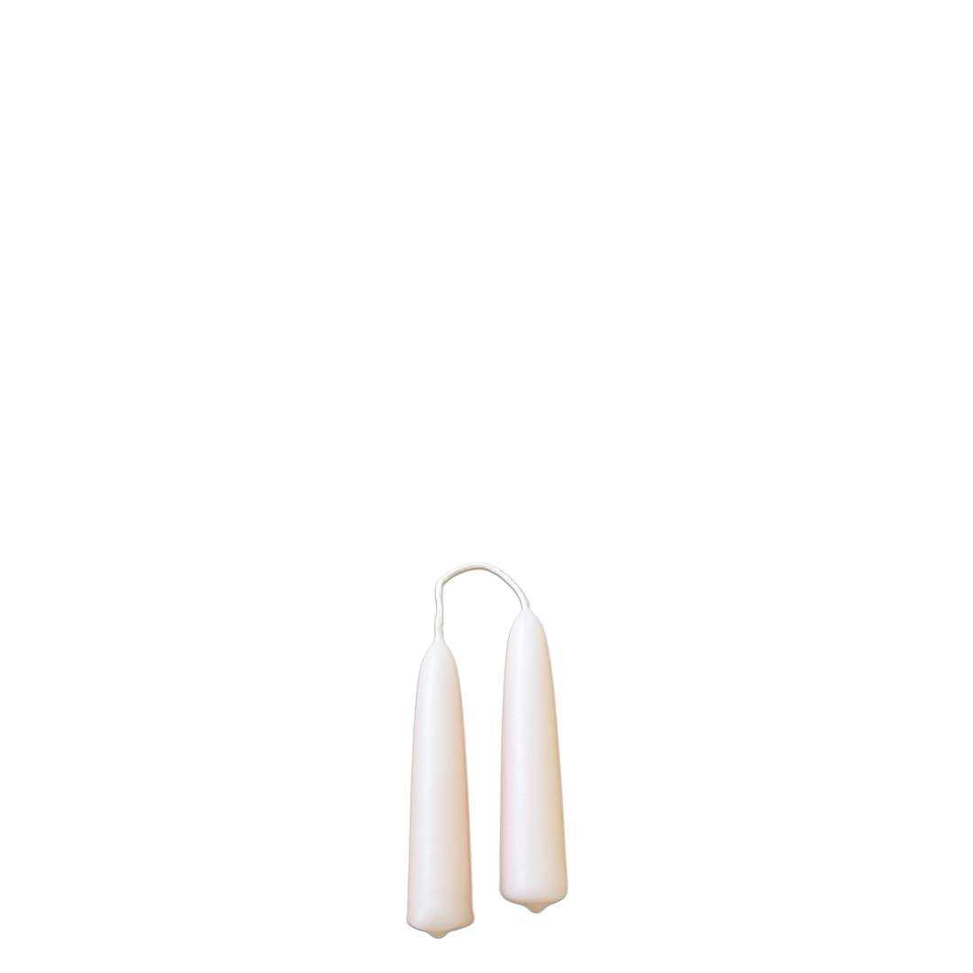 A pair of beeswax hand-dipped mini taper candles  in cashmere, dusty pinkish peach hue