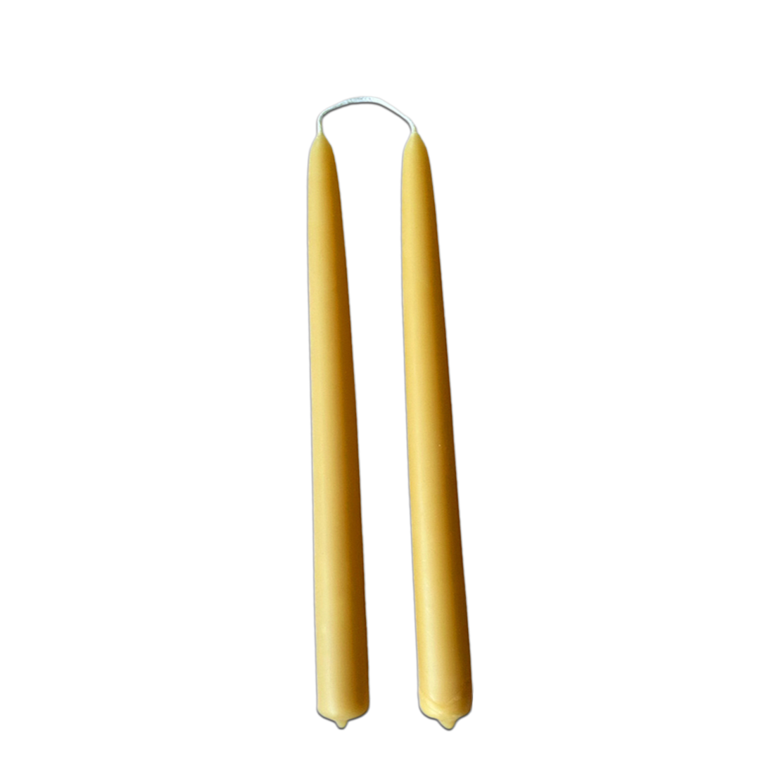 Hand-dipped beeswax taper candles in natural yellow hue no drip, crafted for a luxurious look.