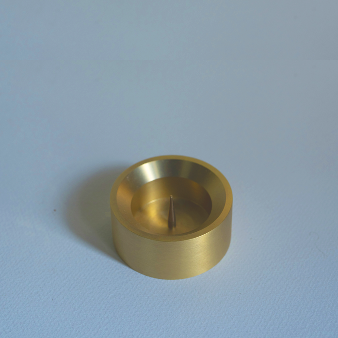 Designed by GLŌAM this holder fit our all types of Candles. Made from solid brass, it has a paperweight-like feel. 
