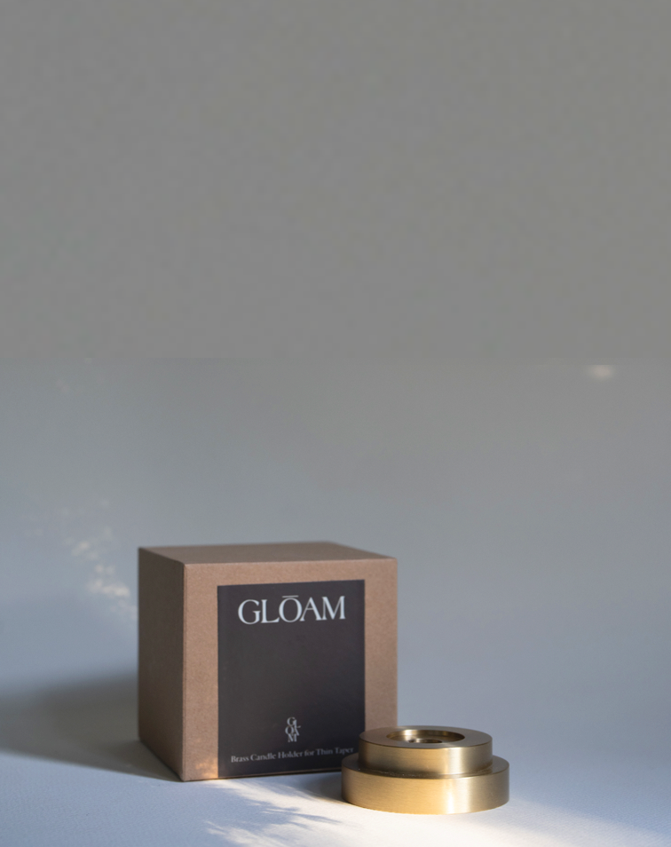 Designed  by GLŌAM this holder fit our Skinny Tapered Candles. Made from solid brass, it has a paperweight-like feel. 