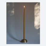 Designed  by GLŌAM this holder fit our Skinny Tapered Candles. Made from solid brass, it has a paperweight-like feel. 