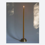 Designed  by GLŌAM this holder fit our Skinny Tapered Candles. Made from solid brass, it has a paperweight-like feel. 