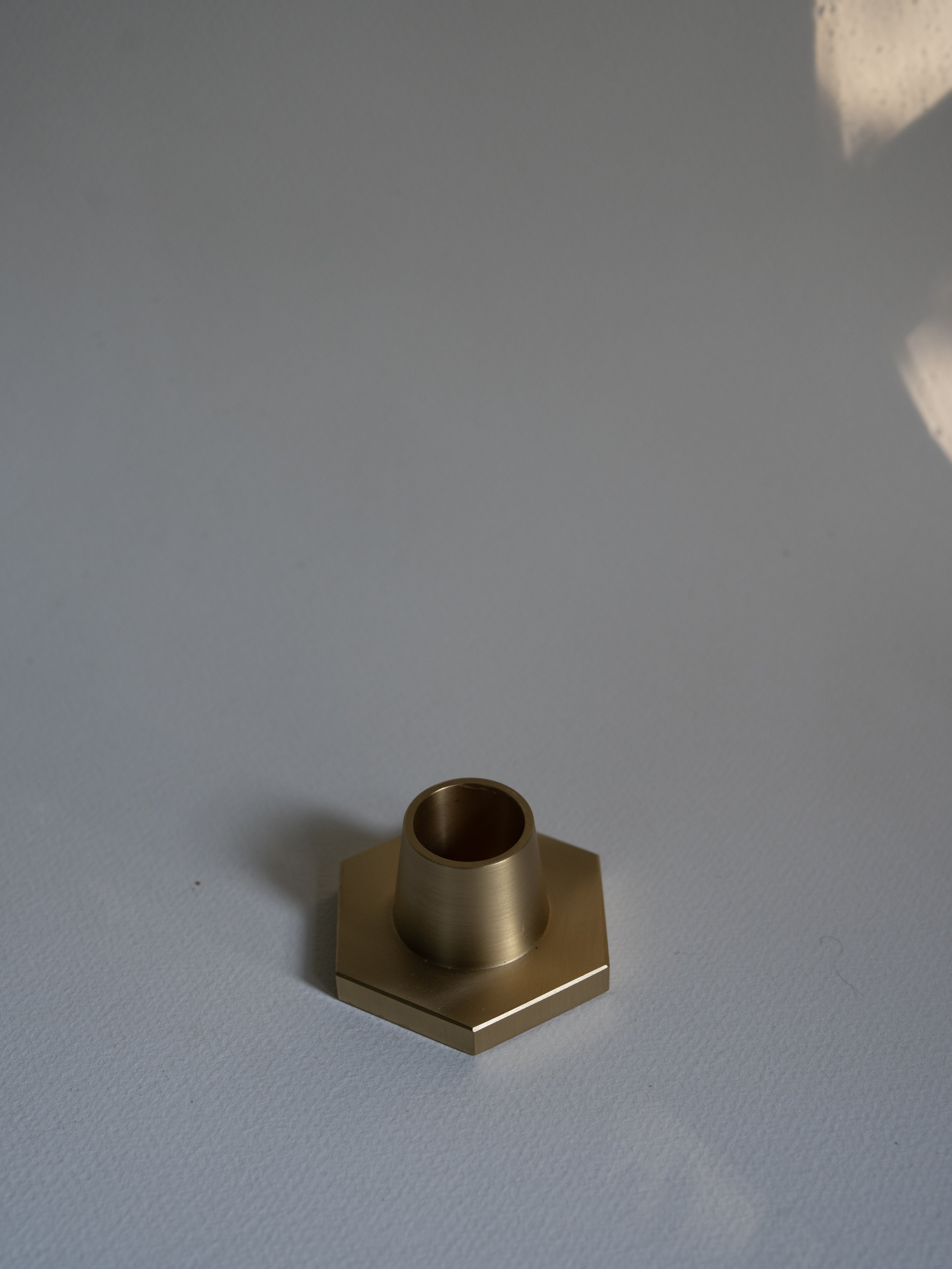 candle holder in solid brass in for classic taper candles  and twisted tapers designed by GLŌAM