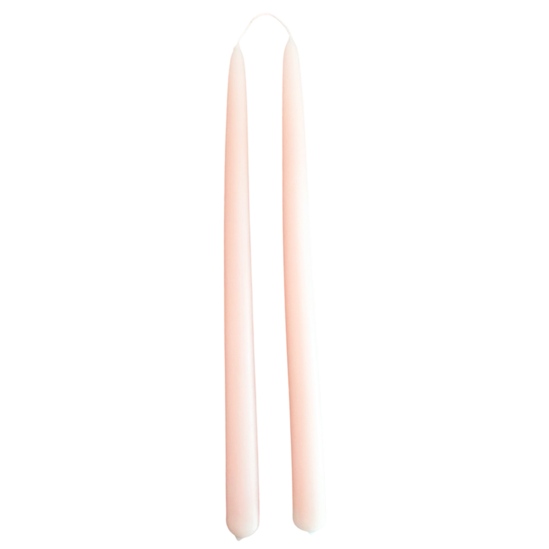 A pair of pure beeswax dripless taper candles, hand dipped in Cashmere