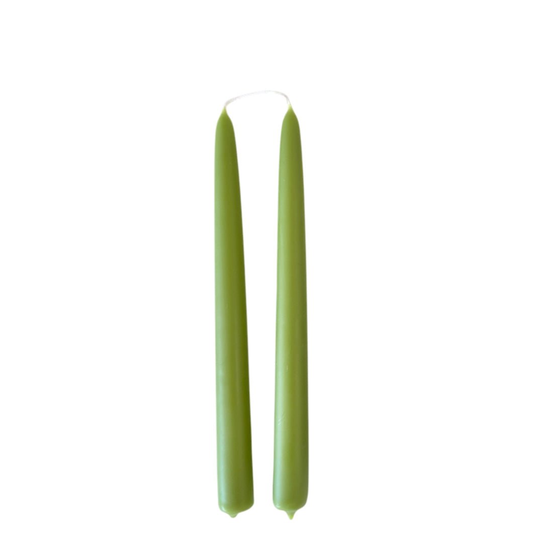 Green hand-dipped beeswax taper candles made with natural plant-based pigments for an eco-friendly, elegant home decor accent.