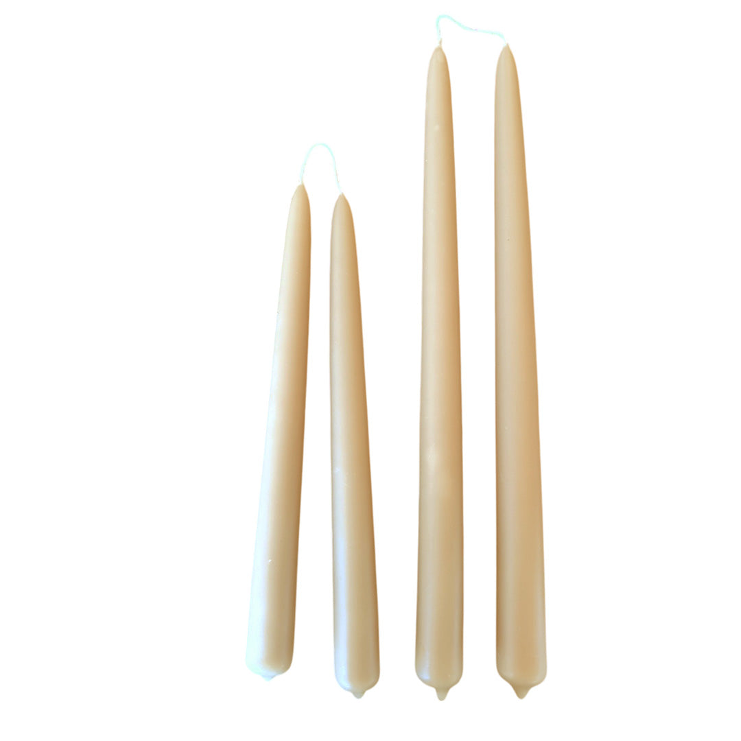 Non-drip hand-dipped taper candles made from pure beeswax in a marzipan beige color.