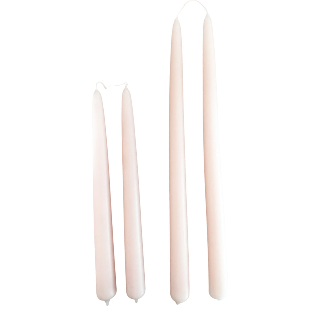 Hand-dipped beeswax taper candles in Cashmere, crafted with plant-based pigments for a luxurious look.