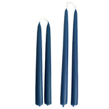Hand-dipped beeswax taper candles in le lavandou, a shade of blue, crafted with plant-based pigments for a luxurious look.