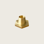 GLŌAM hexagon candlestick, a golden brass taper candle holder for Classic and Twisted beeswax tapers, solid polished brass.