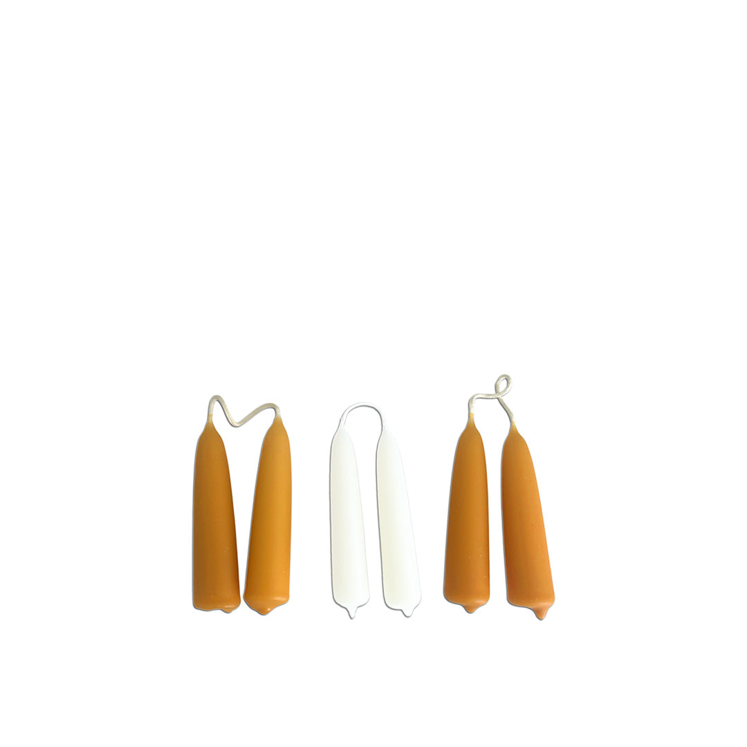 Dripless, beeswax hand-dipped mini taper candles in a trio of Toffee- ochre, caramel and white.  Dripless.  5 hours burn with a beautiful warm flame. brings warmth and elevates any home  or office interiors.