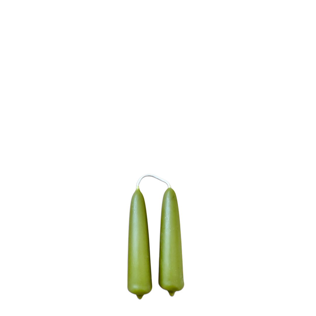 A pair of beeswax mini taper candles in martini, olive green