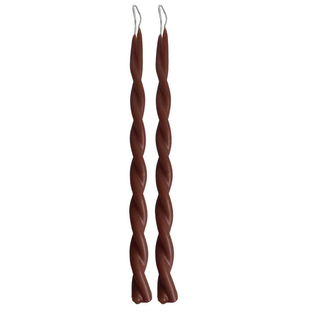 A pair of GLŌAM hand-twisted beeswax candles in Espresso, a brown-coffee hue, crafted with plant-based pigments.