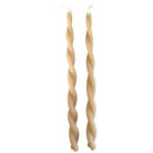 A pair of GLŌAM hand-twisted beeswax candles in marzipan beige, crafted with plant-based pigments.
