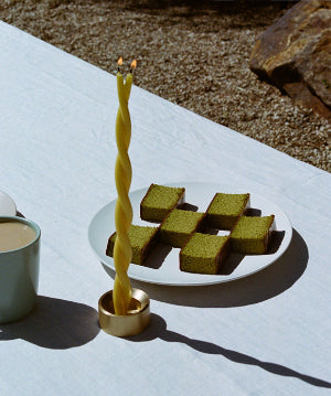 GLŌAM spike golden brass candlestick, a versatile taper candle holder that fits Classic, Twisted, and Stubby candles, solid polished brass.