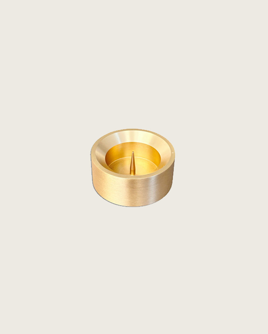 GLŌAM spike golden brass candlestick, a versatile taper candle holder that fits Classic, Twisted, and stubby candles, solid polished brass