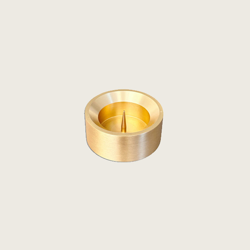 GLŌAM spike golden brass candlestick, a versatile taper candle holder that fits Classic, Twisted, and stubby candles, solid polished brass