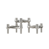 STOFF Nagel BMF candle holders in brushed chrome, three faceted modular holders with continuous flowing lines and a soft satin finish