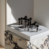 The iconic STOFF Nagel candle holder in dark metallic  edition is a futuristic expression brings elegance and a masculine vibe into the interior decor.