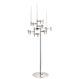 STOFF Nagel floor stand holding six faceted BMF candle holders in polished chrome with white taper candles, a freestanding modular sculpture