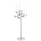 STOFF Nagel floor stand holding six faceted BMF candle holders in polished chrome with white taper candles, a freestanding modular sculpture